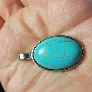 TGGC Oval Shaped Turquoise Pendant In Sterling Silver